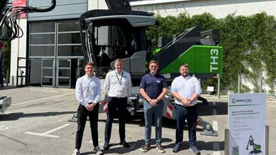Blue Machinery And Green-Tec Team Members Infront Of Tree Care Grabber