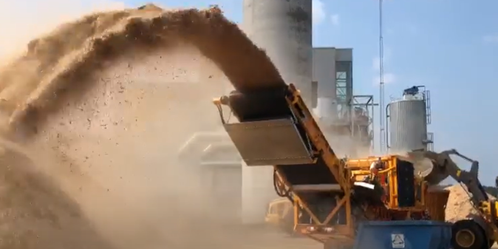 CBI grinder processing wood waste for biomass