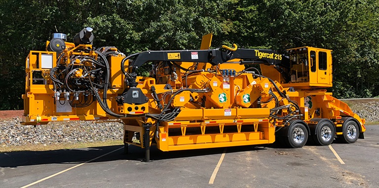 604 chain flail debarker with loader