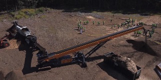 CBI's TC75R Tracked Radial Stacker Conveyor Working Onsite In Newton, New Hampshire At CBI's Factory Forum.