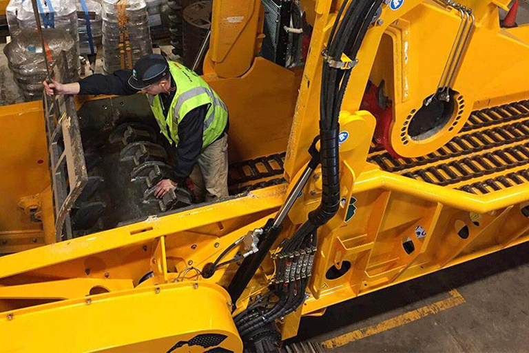 CBI Team Member Working on Grinder Chamber