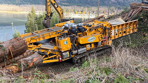 CBI Horizontal Grinder working in a land clearing project
