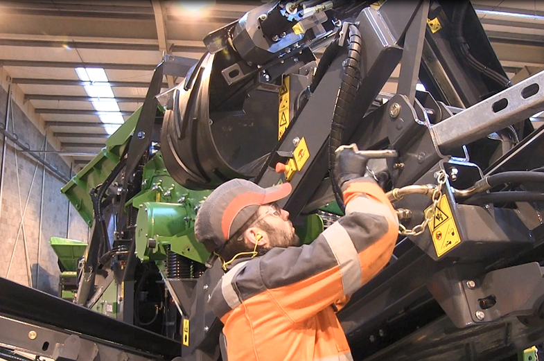 Worker Performing Training On Crusher