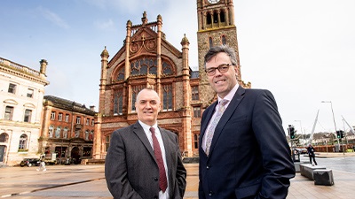 Kieran Hegarty President of Terex MP outside Guildhall Derry