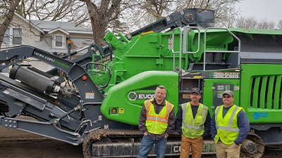 Larsen Dirtworks Team In Front of Cobra Crusher