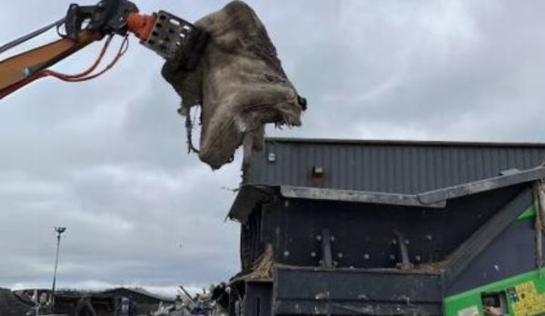 Mattress Being Fed Into Shredder