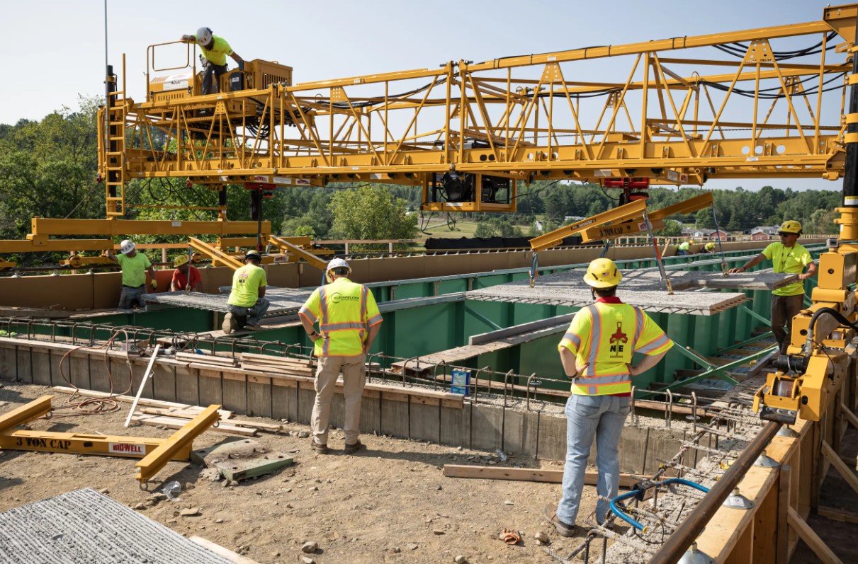 Men Using Bid-Well MT Series For Bridge Construction