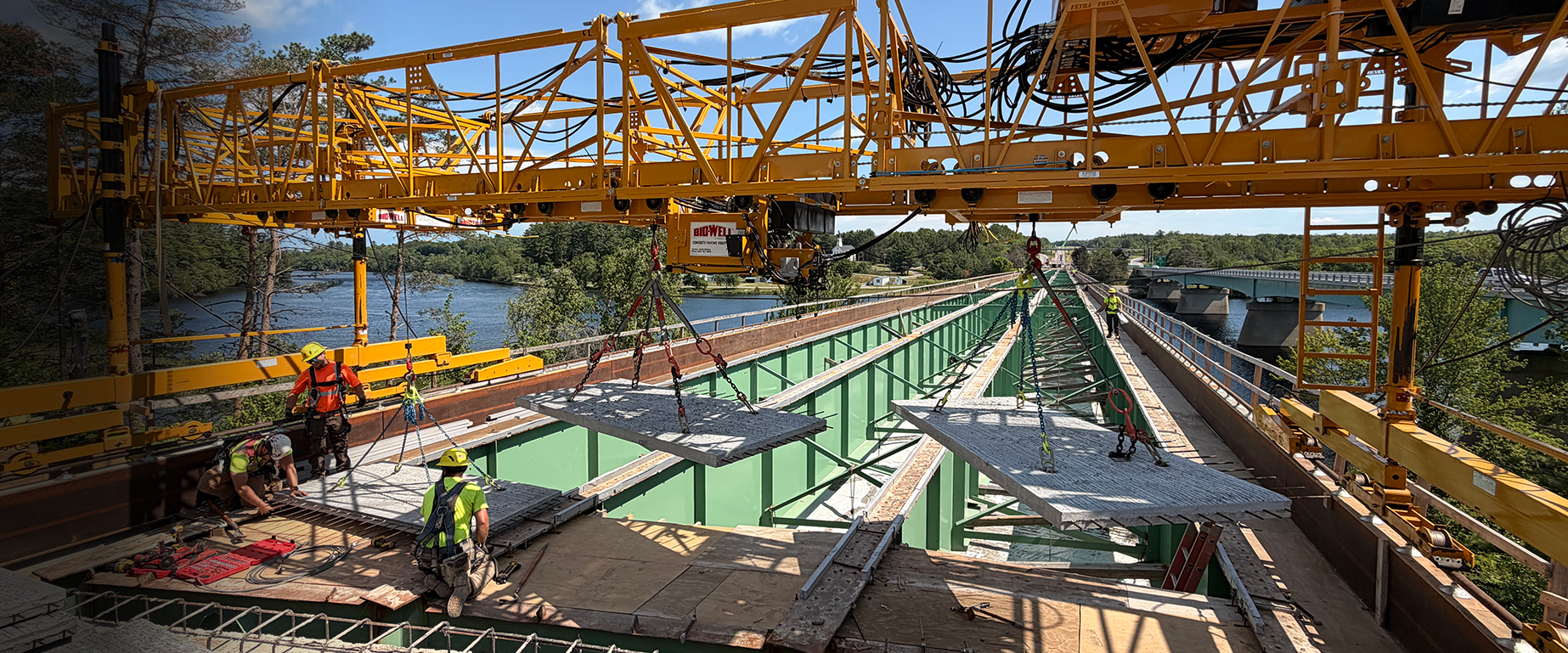 Bid-Well Accessories Page Header Showing Bridge Being Constructed