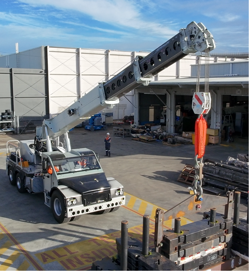 Franna Crane Lifting Object in Yard