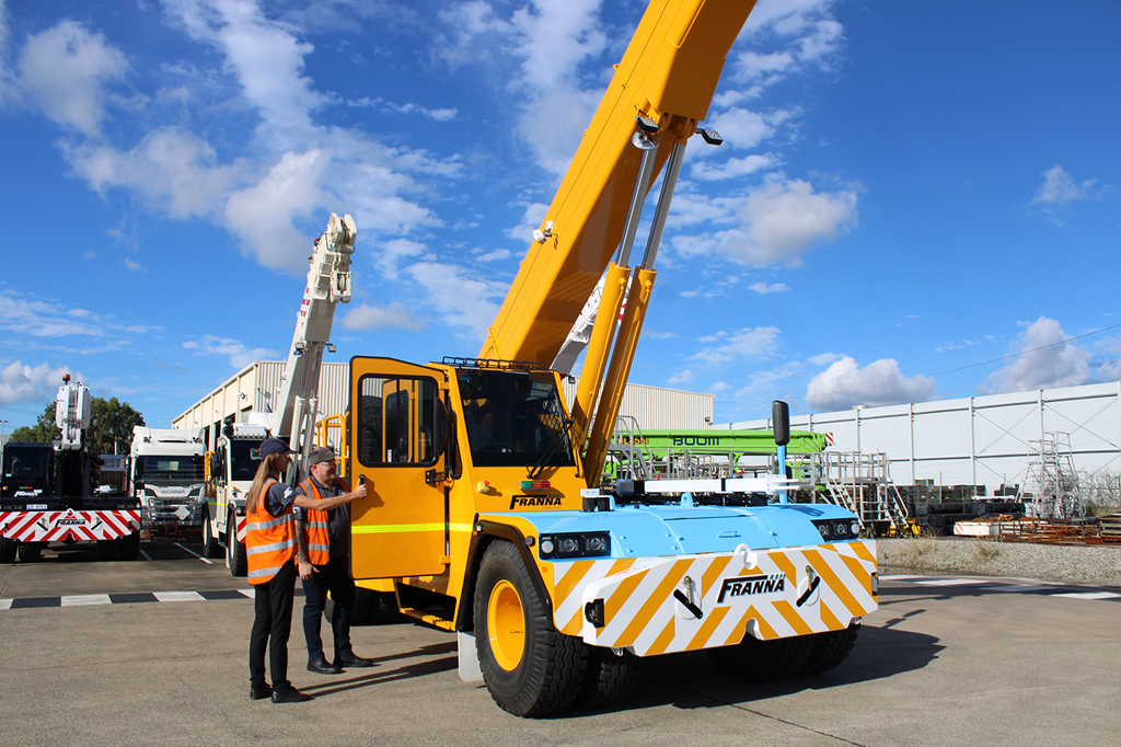 Franna Sales Team Inspecting A Crane