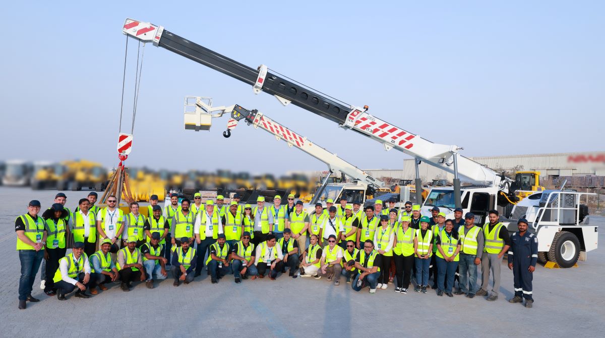 Conference Attendees Infront of Franna Cranes
