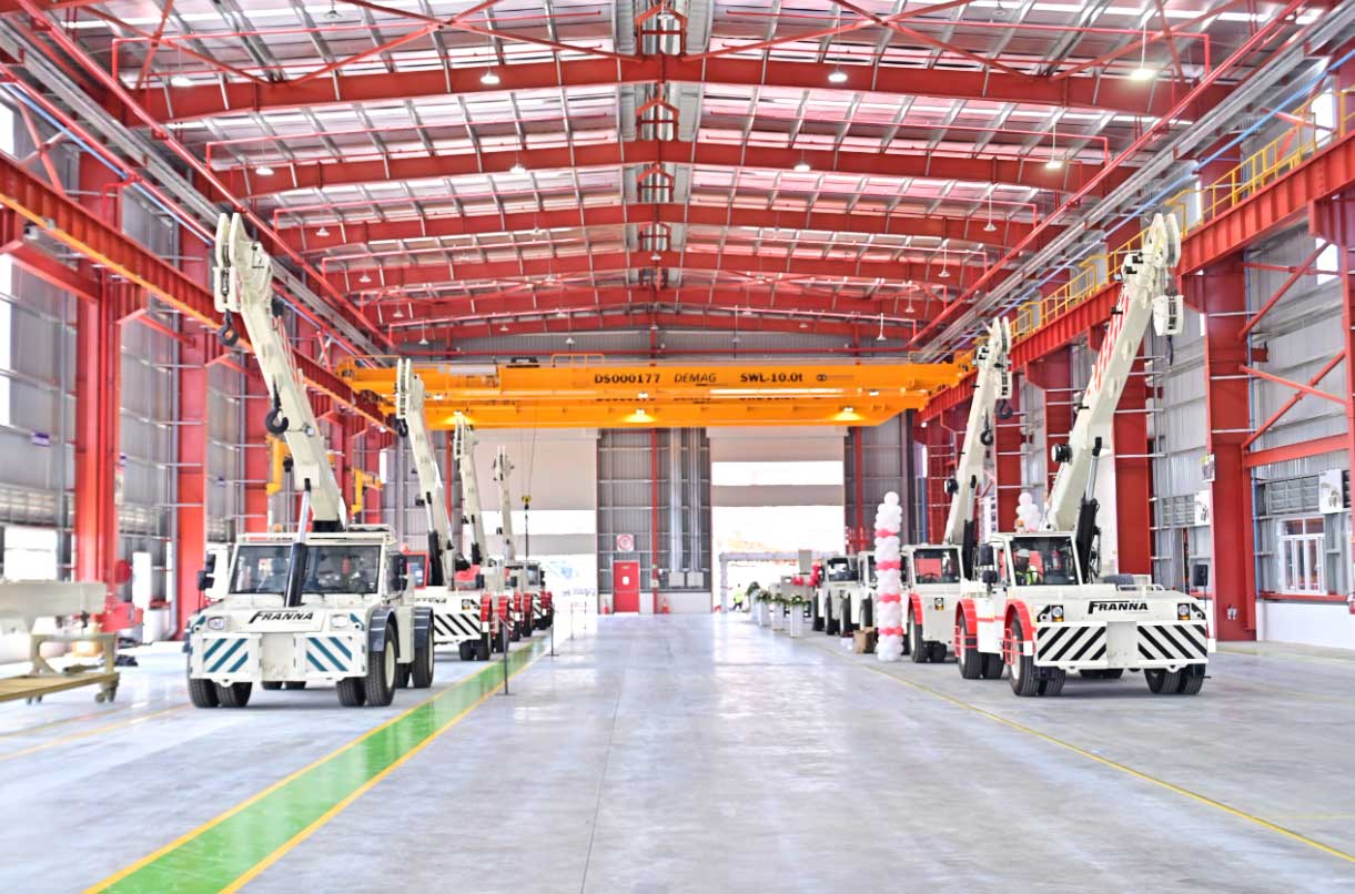 Franna Cranes Lined Up Inside Factory