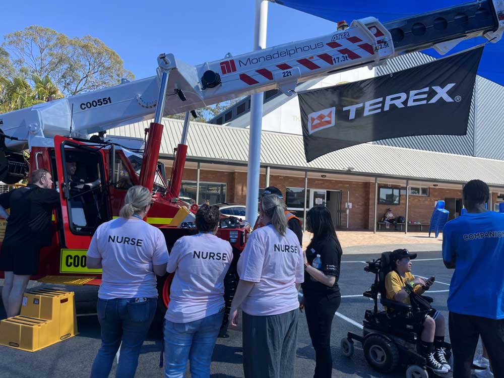 People Looking at Pick and Carry Crane