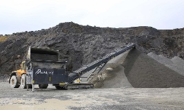 Tracked Feeder Being Loaded By Shovel