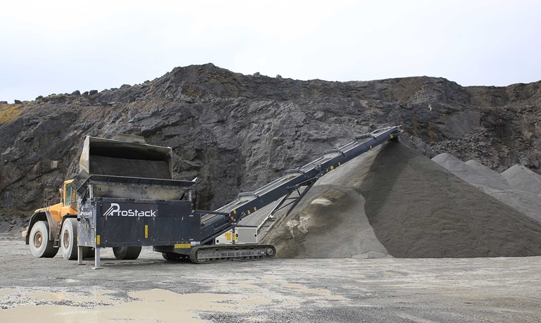 Tracked Feeder Being Loaded By Shovel