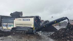 Ecotec's TTS 518T Tracked Trommel Screen Processing Green Waste