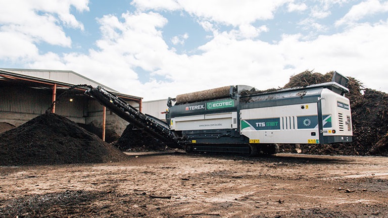 Ecotec's TTS 518T Tracked Trommel Screen Creating Soil
