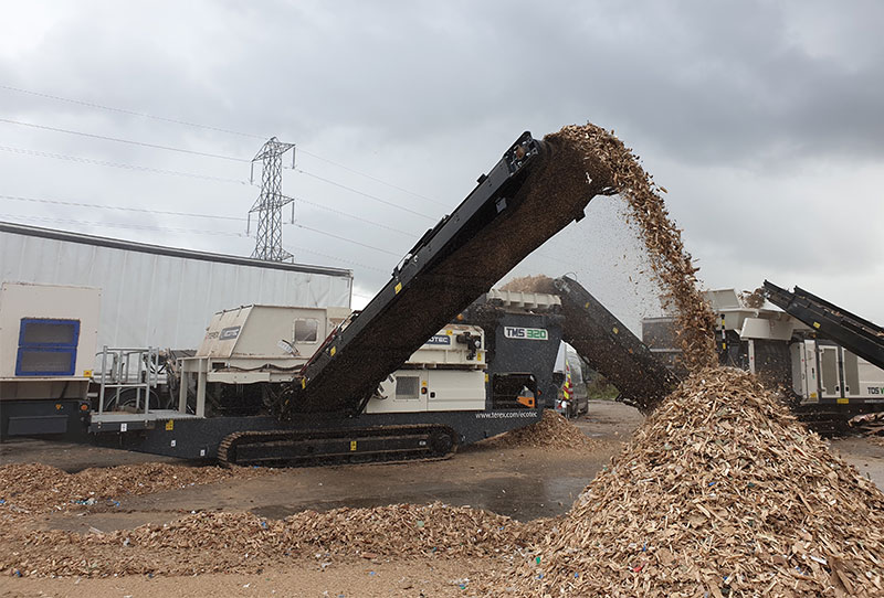 Ecotec's TMS 320 Metal Separator working with waste wood, removing ferrous and non ferrous metal from it.