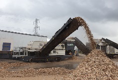 Ecotec's TMS 320 Metal Separator working with waste wood, removing ferrous and non ferrous metal from it.