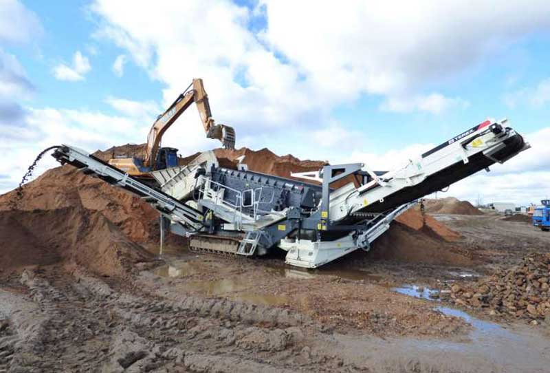 Ecotec's TRS 550 Recycling Screen Working In The UK Screening Soil Which Is Wet And Sticky