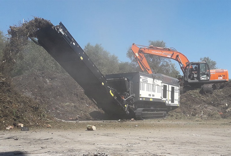 Ecotec TSS 390T Tracked Single Shaft Shredder Processing Green Waste