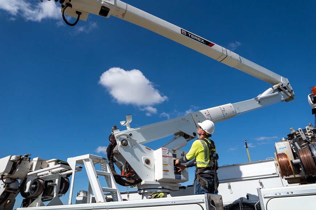 Utility worker operating a Terex bucket truck