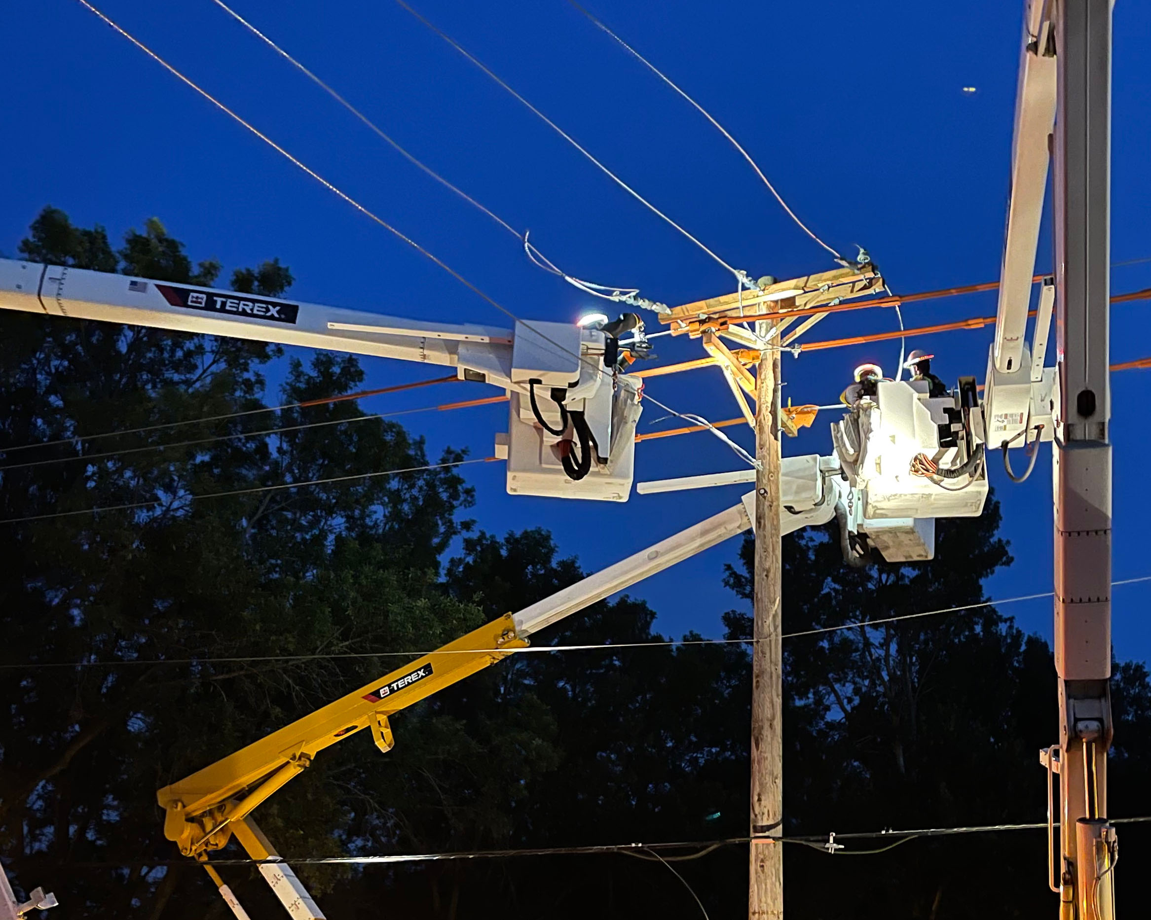 Lineworkers Restoring Power Following Storm