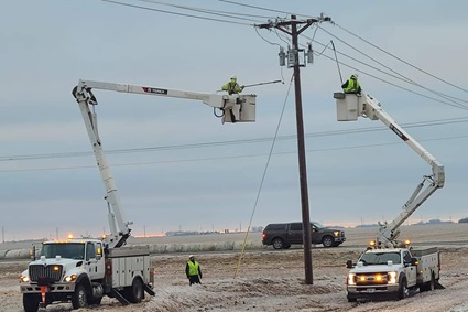 Terex bucket trucks working on lines in winter