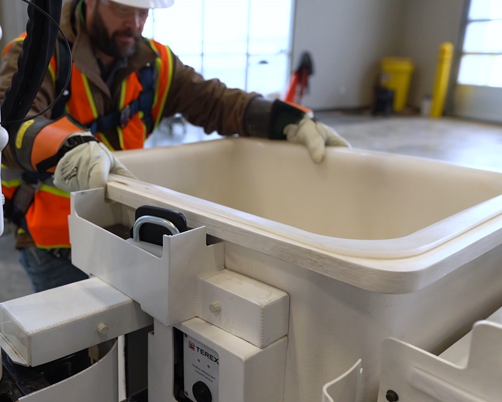 Utility worker entering Terex bucket
