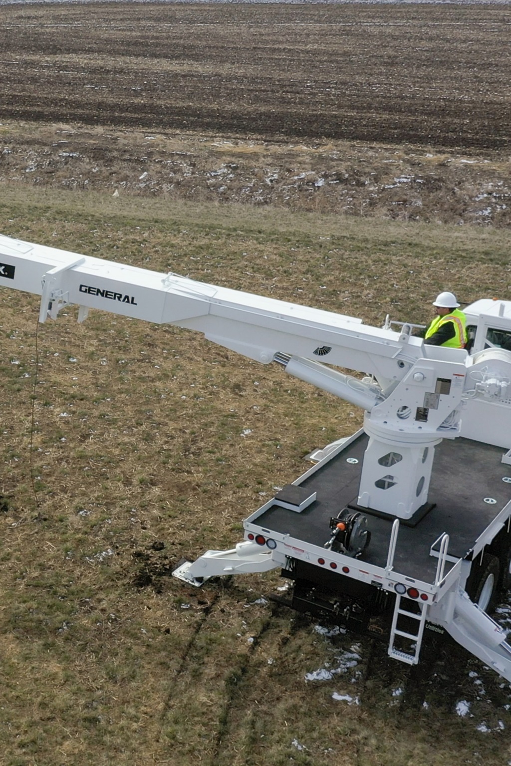 Lineworker operating Terex general series digger derrick