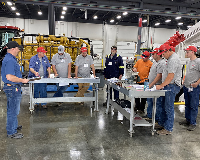 Technicians standing at table