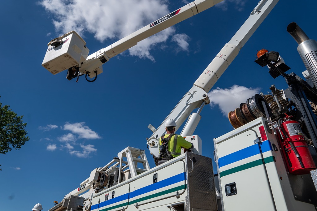 Utility lineworker operating Terex bucket truck