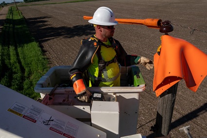 Power lineman working on power lines