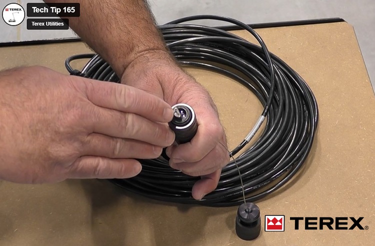 Person holding a cable