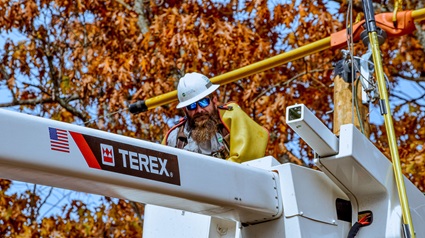 Utility lineworker in Terex bucket truck