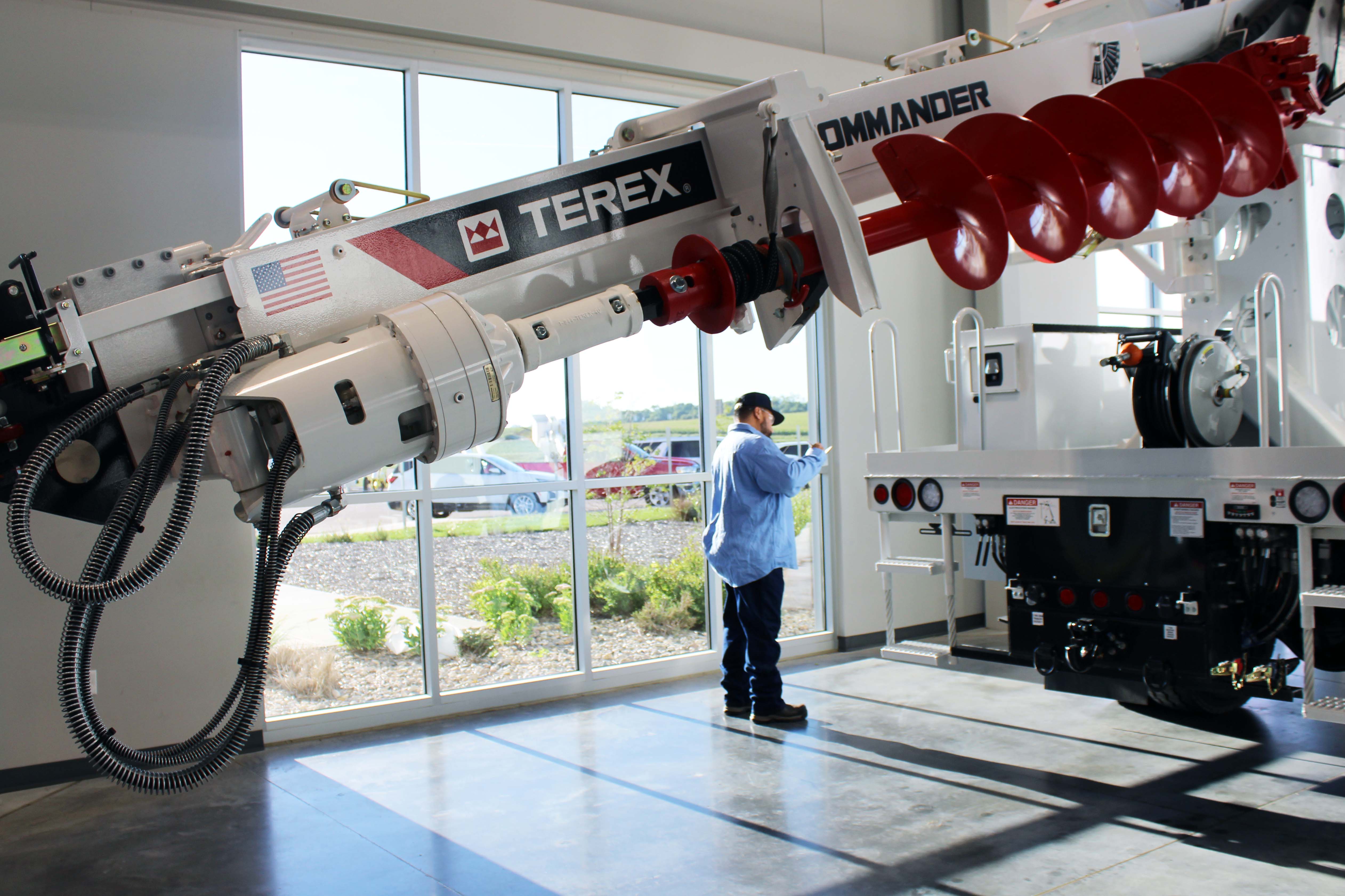 Technician working on Terex digger derrick