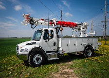 Terex digger derrick sitting in field