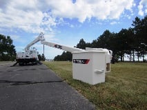 Terex HRX Overcenter Bucket Truck stretches across road