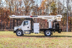 Terex XT Pro 60 tree trimmer parked in field