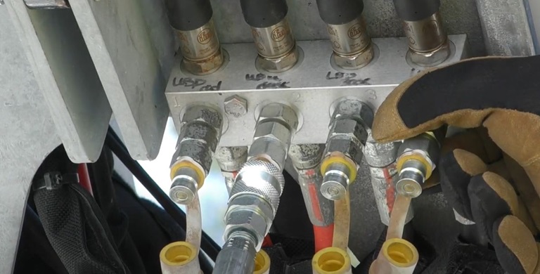 Terex technician working on hydraulics