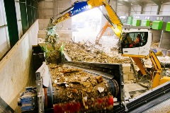 Material-Being-Fed-Into-Waste-Feeder