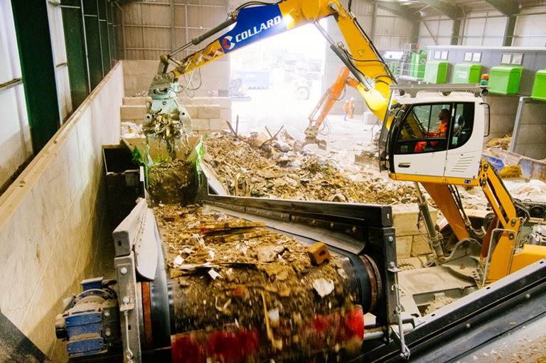 Material-Being-Fed-Into-Waste-Feeder