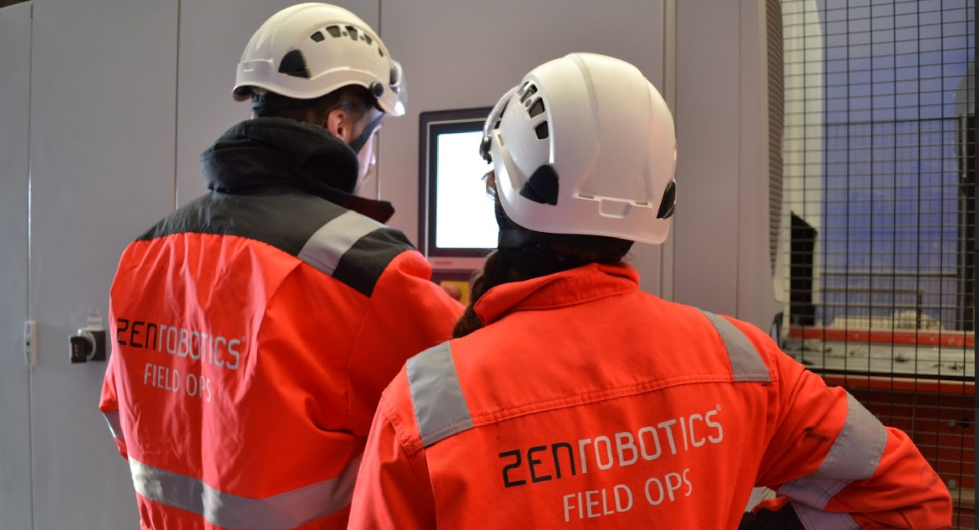 ZenRobotics Employees Servicing Machine